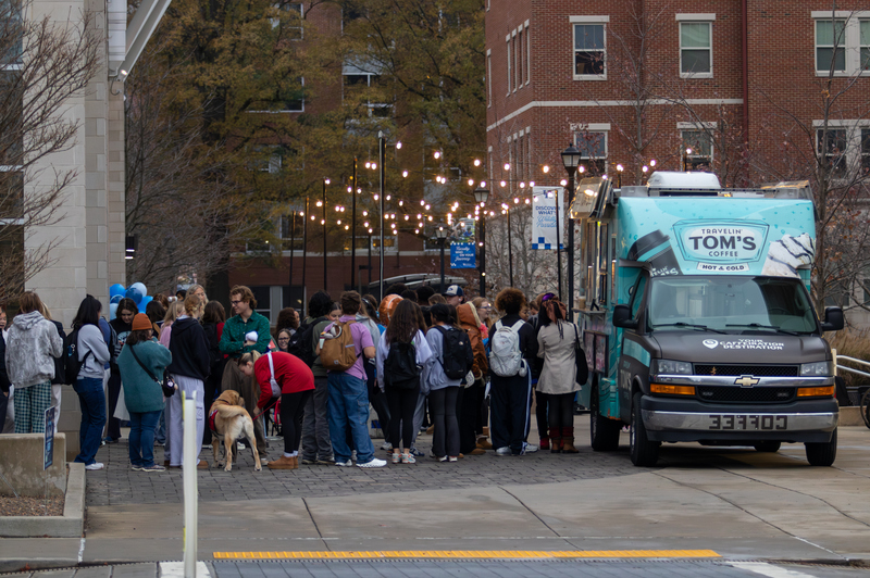 Students line up at Travelin' Tom's Coffee food truck during the Winter Frost event on Tuesday, Dec. 10, 2024, outside The 90 in Lexington, Kentucky. Photo by Sydney Novack | Staff