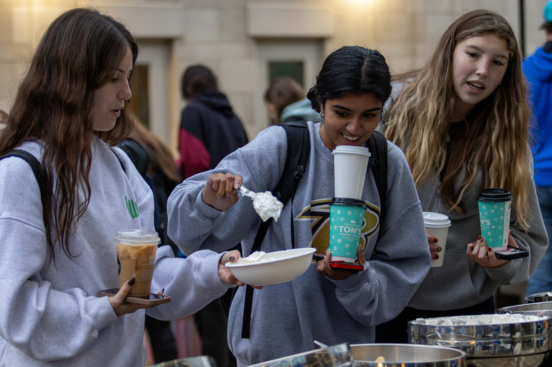 Students make bowls of ice cream during the Winter Frost event on Tuesday, Dec. 10, 2024, outside The 90 in Lexington, Kentucky. Photo by Sydney Novack | Staff