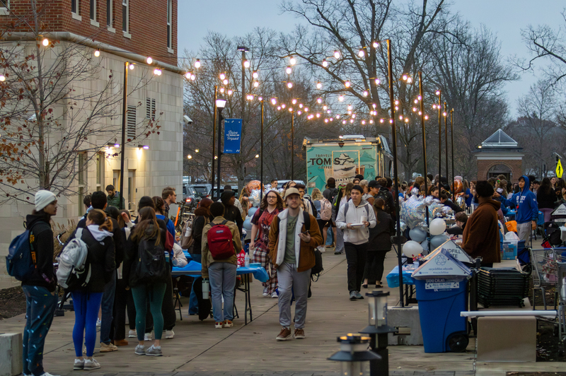 Students line up at Travelin' Tom's Coffee food truck and congregate during the Winter Frost event on Tuesday, Dec. 10, 2024, outside The 90 in Lexington, Kentucky. Photo by Sydney Novack | Staff