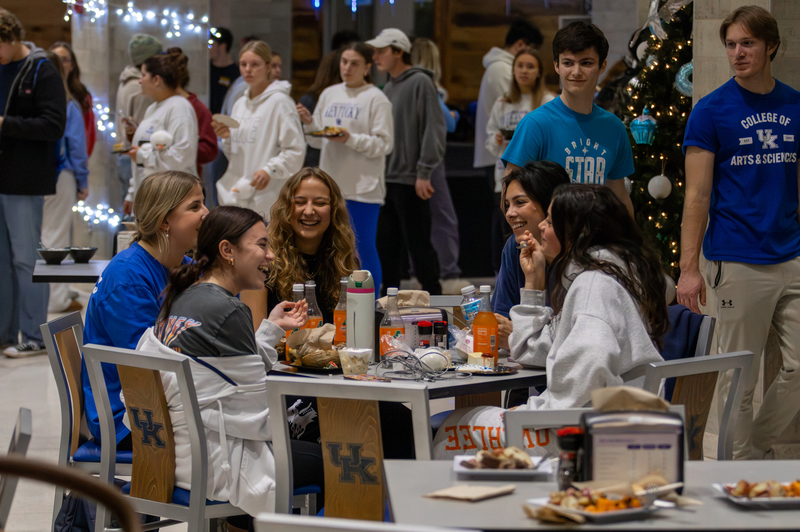 Students eat together during the Winter Frost event on Tuesday, Dec. 10, 2024, at The 90 in Lexington, Kentucky. Photo by Sydney Novack | Staff