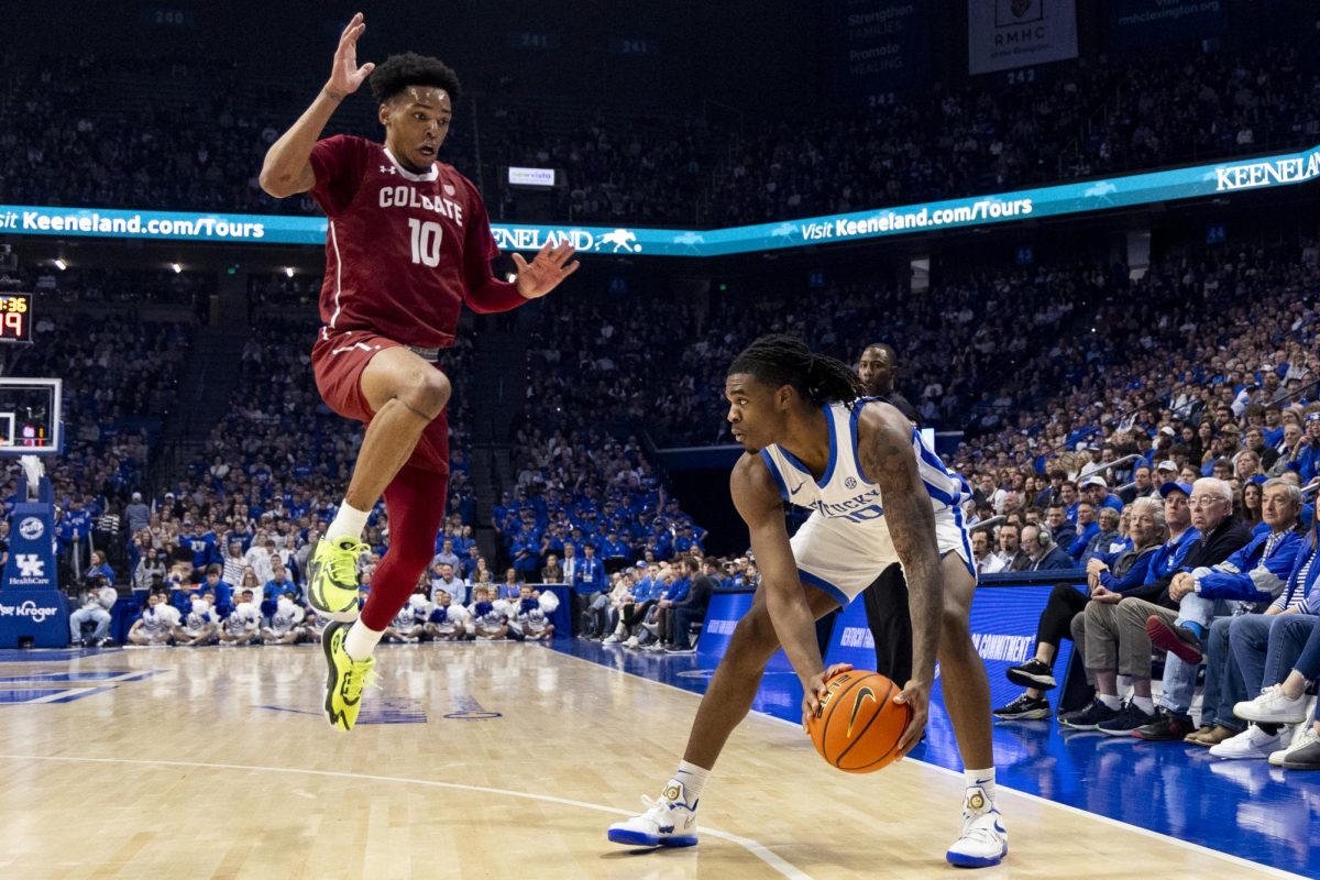 Kentucky Wildcats guard Otega Oweh (0) gets Colgate Raiders guard Chandler Baker (10) to jump after a pump fake during the basketball game vs. Colgate on Wednesday, Dec. 11, 2024, at Rupp Arena in Lexington, Kentucky. Photo by Matthew Mueller | Photo Editor