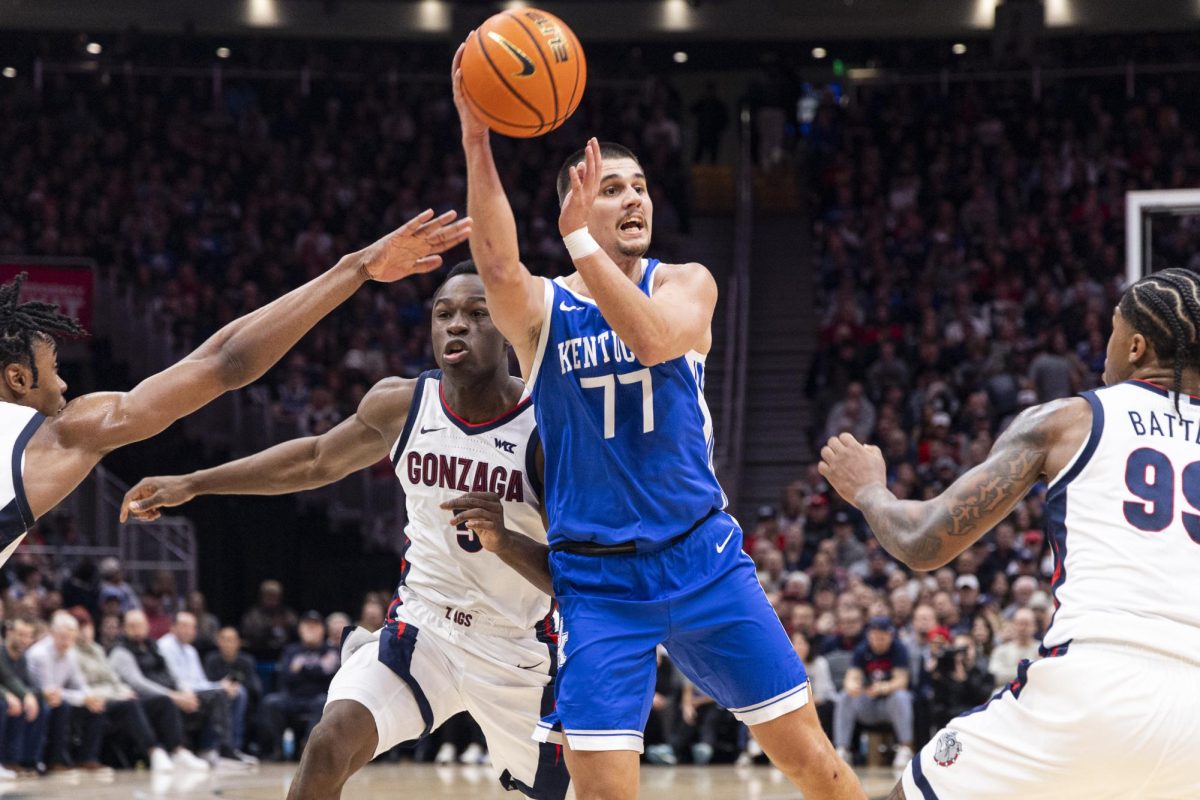 Kentucky Wildcats guard Kerr Kriisa (77) passes the ball out to the three-point line during the basketball game vs. Gonzaga on Saturday, Dec. 7, 2024, at Climate Pledge Arena in Seattle, Washington. Photo by Matthew Mueller | Photo Editor