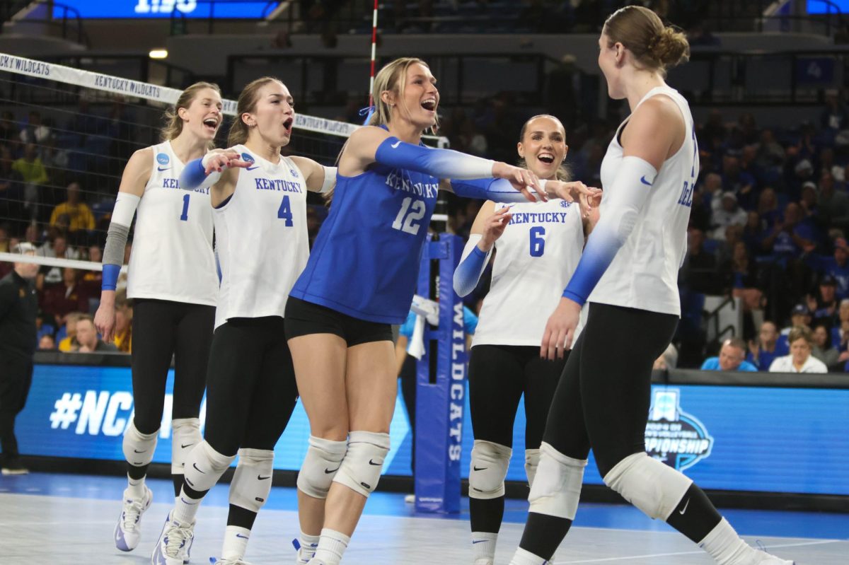 Kentucky Wildcats outside hitter Brooklyn DeLeye (17) celebrates with teammates after getting an ace during the volleyball match vs. Minnesota on Friday, Dec, 6, 2024, at Historic Memorial Coliseum in Lexington, Kentucky. Kentucky won 3-1. Photo by Robby Robinson.