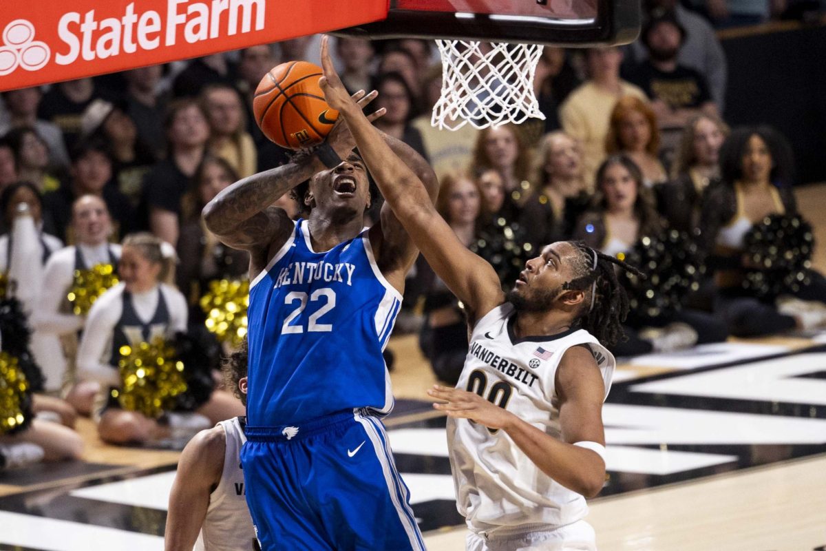 Kentucky Wildcats forward Ansley Almonor (15) gets fouled by Vanderbilt Commodores forward Devin McGlockton (99) during the basketball game vs. Vanderbilt on Saturday, Jan. 25, 2025, at Memorial Gymnasium in Nashville, Tennessee. Kentucky lost 74-69. Photo by Matthew Mueller | Photo Editor