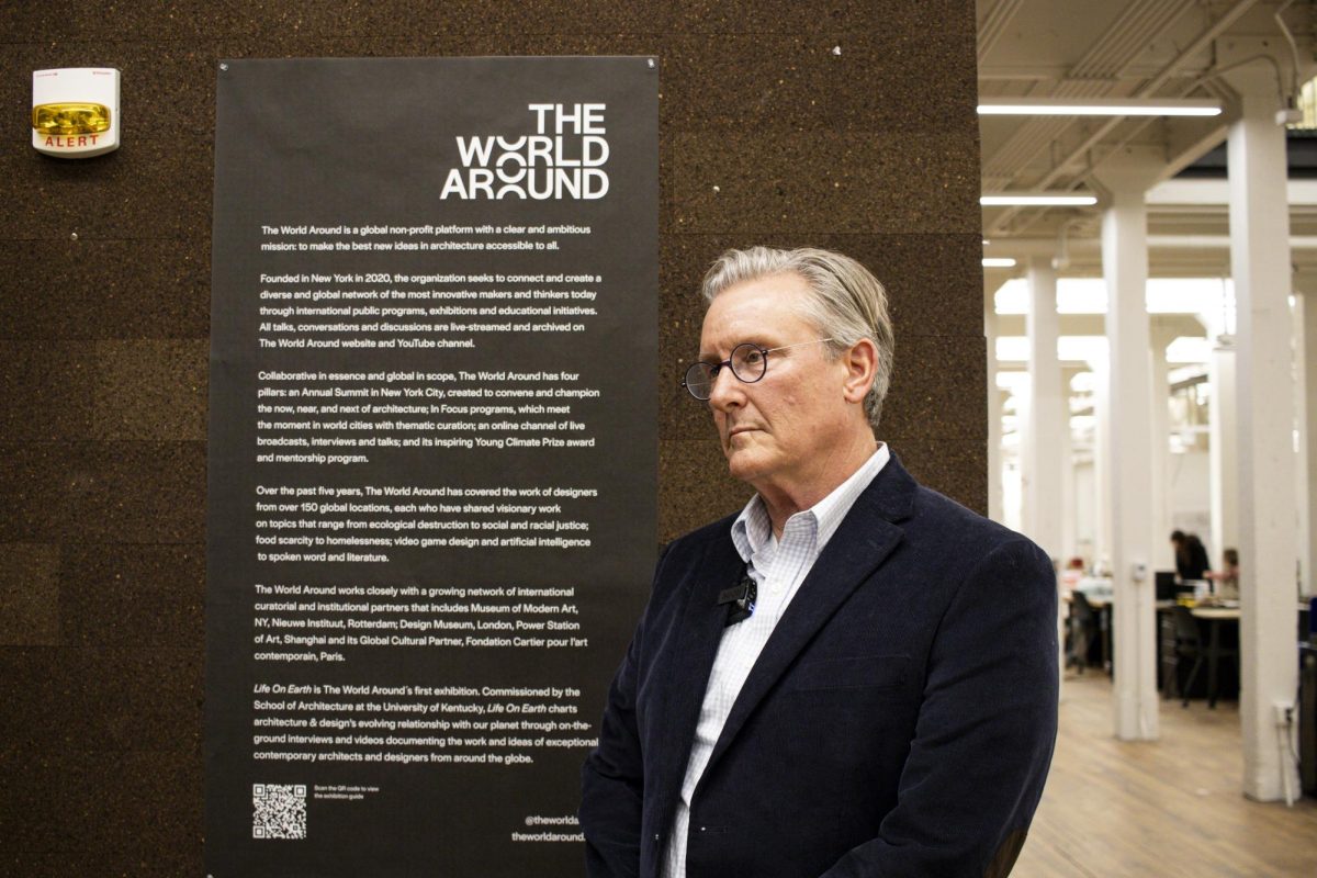 Dean Ned Crankshaw is being interviewed at the opening of the Life On Earth exhibition in Gray Design on Friday Jan 24th. Photo by Siler Bargo | Staff