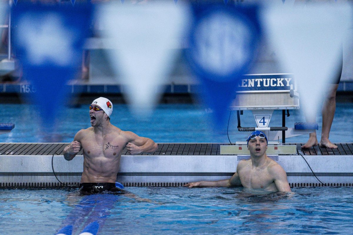 A Louisville swimmer celebrates after beating  the Kentucky swimmer in the 200 meter freestyle during the swim meet vs. Kentucky on Saturday, Jan. 25, 2025, at the Lancaster Aquatic Center in Lexington, Kentucky. Photo by Christian Kantosky | Assistant Photo Editor