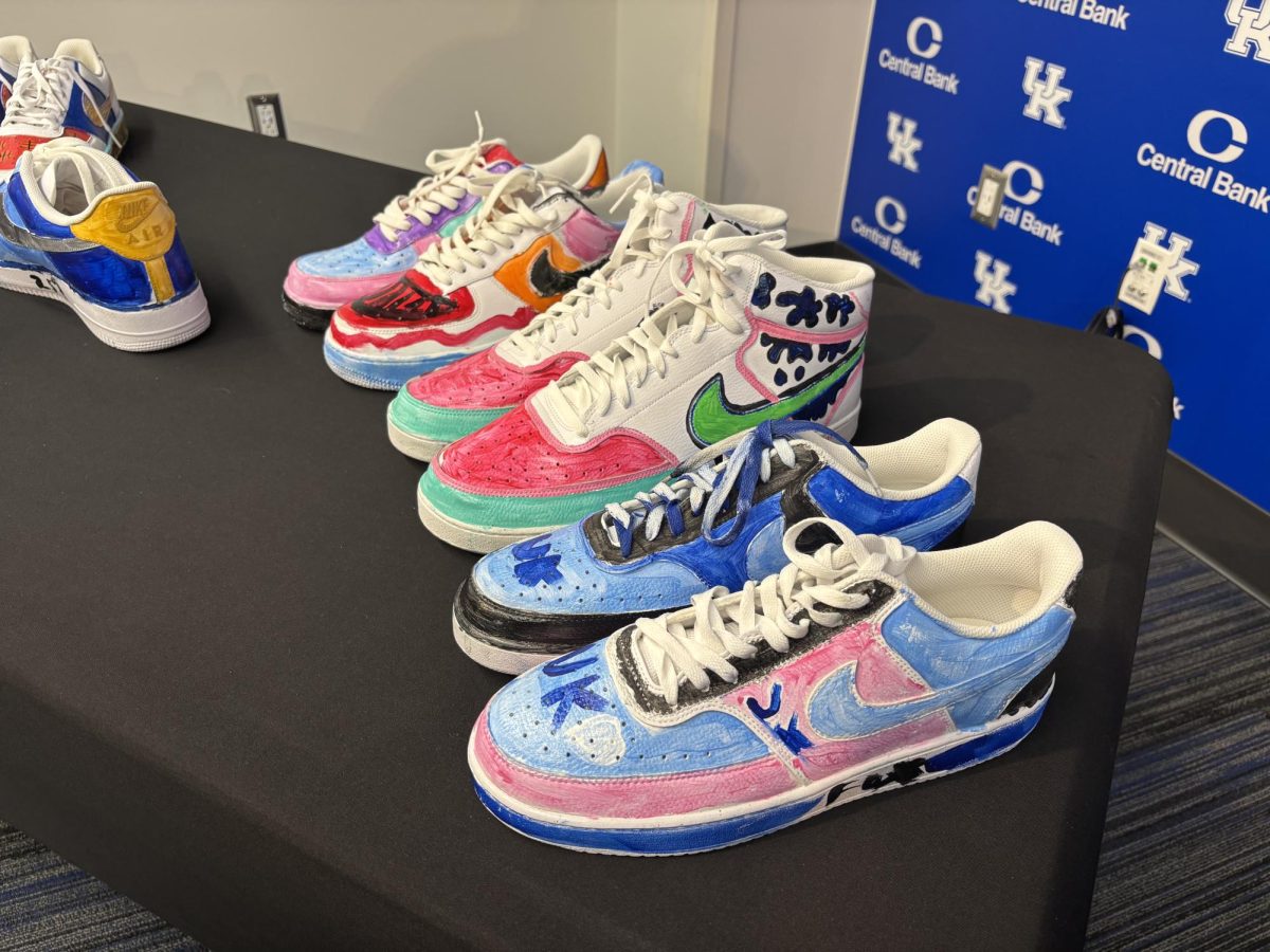 A display featuring the custom pairs of shoes painted by pediatric cancer patients for the men's basketball coaching staff inside Historic Memorial Coliseum on Thursday, Jan. 30, 2025. Photo by Cole Parke.