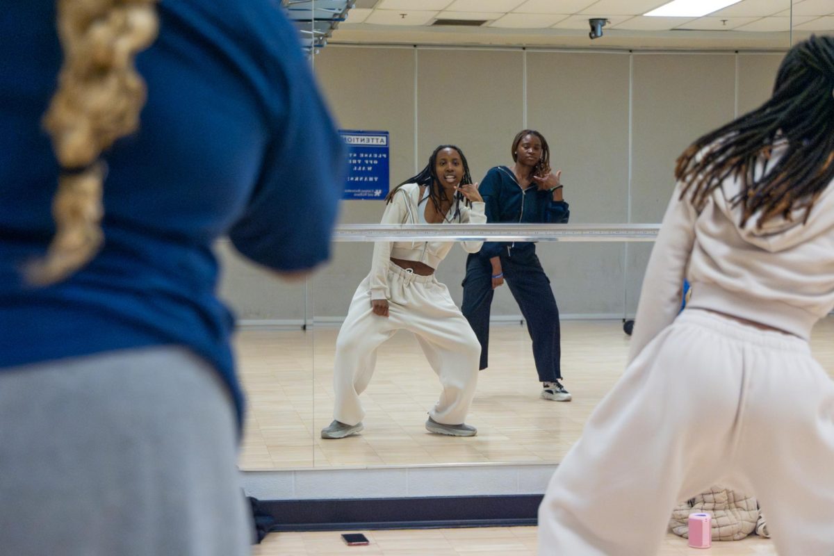 Jasmyne Meriwether, a University of Kentucky alumni, dances to music during the K-pop dance workshop hosted by the Korean Language and Culture Club on Friday, Feb. 21, 2025, at Johnson Center Gym White in Lexington, Kentucky. Photo by Sydney Novack | Staff