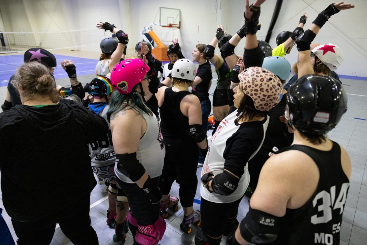 ROCK huddles to finish the roller derby practice on Sunday, Feb. 2, 2025, at The Yard in Lexington, Kentucky. Photo by Sydney Yonker | Staff