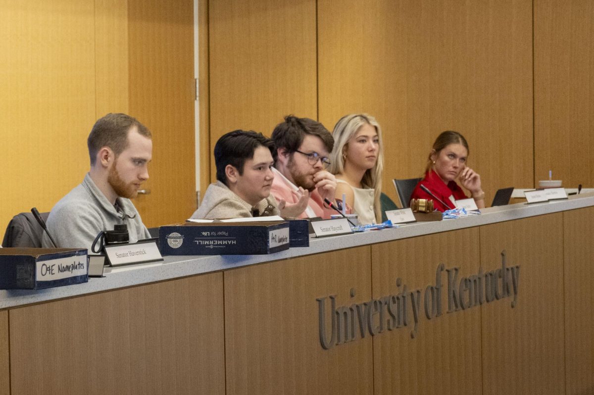 University of Kentucky Student Government Association senate executive council members discuss the Y’all Means All resolution, on Wednesday, Feb. 12, 2025, in the E. Britt Brockman Senate Chamber in the Gatton Student Center in Lexington, Kentucky. Photo by Casey Sebastiano | Staff
