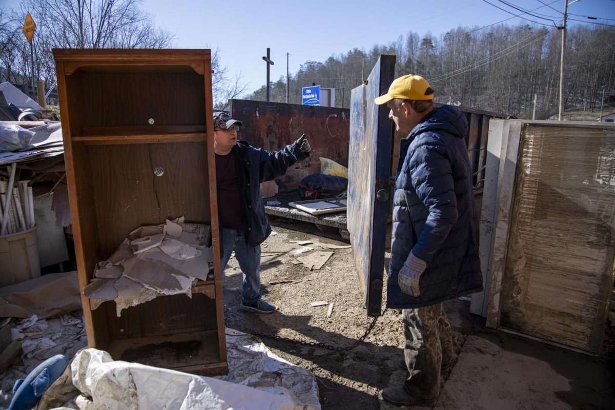 Brian Bridges, senior pastor at the First Church of God, talks with Pearl Cowell while they clean debris on Monday, Feb. 24, 2025, at the First Church of God in Chavies, Kentucky. Photo by Christian Kantosky | Assistant Photo Editor