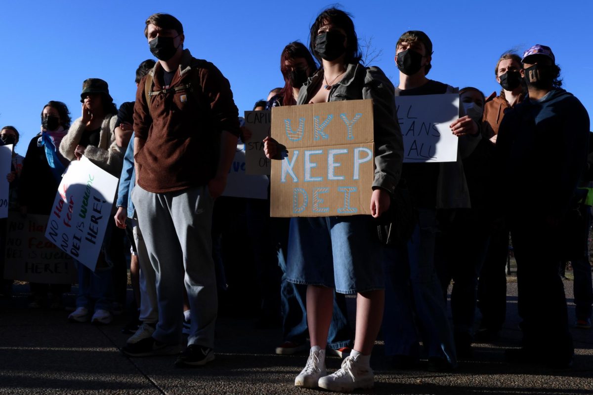 A crowd of students gather with signs to protest outside the William T. Young Library during the Day of DEI Protest on Friday, Feb. 28, 2025, at the University of Kentucky in Lexington, Kentucky. Photo by Christian Kantosky | Assistant Photo Editor