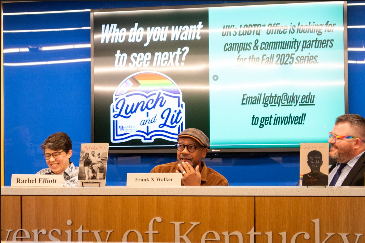 Authors Rachel Elliot and Willie Carver Jr. watch Frank X Walker deliver a story to the audience during the LGBT Trailblazers event on Monday, March 3, 2025, at the Gatton Student Center in Lexington, Kentucky. Photo by Rachel Trotter | Staff