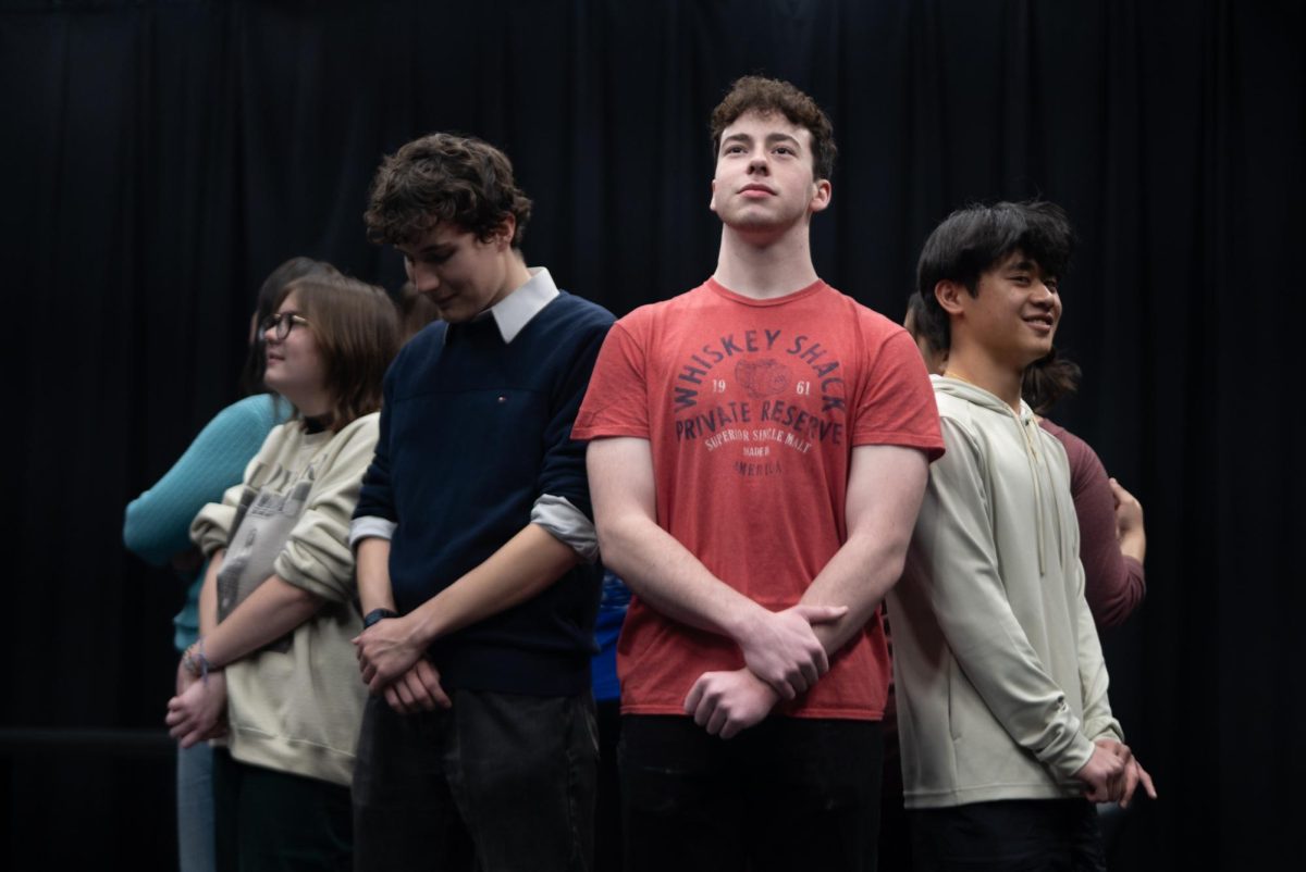 Members form a circle for a group warmup during the Skitty Cats Improv Club meeting on Wednesday, March 6, 2025, at the Fine Arts Building. Photo by Dayssia Jones | Staff