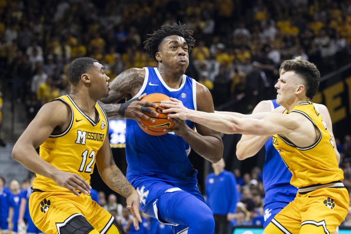 Kentucky Wildcats center Amari Williams (22) gets fouled while driving to the basket during the basketball game vs. the Missouri Tigers on Tuesday, March. 8, 2025, at Mizzou Arena in Columbia, Missouri. Kentucky won the game 91-83. Photo by Matthew Mueller | Photo Editor