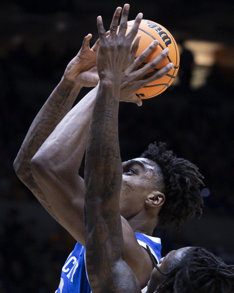Kentucky Wildcats center Amari Williams jumps over Tennessee Volunteers forward Felix Okpara to score during the NCAA men’s basketball tournament Sweet Sixteen game vs. the Tennessee Volunteers on Friday, March 28, 2025, at Lucas Oil Stadium in Indianapolis, Indiana. Tennessee won 78-65. Photo by Christian Kantosky | Assistant Photo Editor