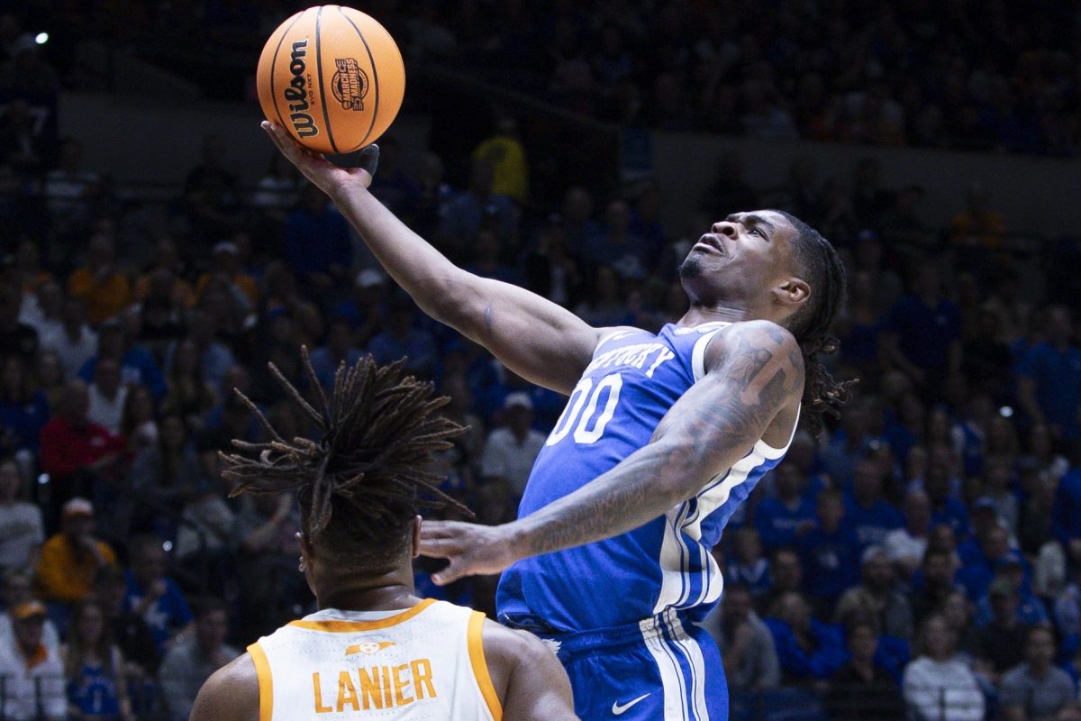 Kentucky Wildcats guard Otega Oweh jumps to score over Tennessee Volunteers guard Chaz Lanier during the NCAA men’s basketball tournament Sweet Sixteen game vs. the Tennessee Volunteers on Friday, March 28, 2025, at Lucas Oil Stadium in Indianapolis, Indiana. Tennessee won 78-65. Photo by Christian Kantosky | Assistant Photo Editor