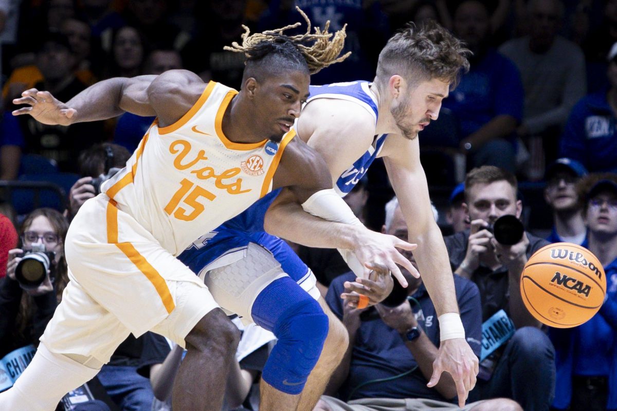 Kentucky Wildcats forward Andrew Carr and Tennessee Volunteers guard Jahmai Mashack scrap for the ball during the NCAA men’s basketball tournament Sweet Sixteen game vs. the Tennessee Volunteers on Friday, March 28, 2025, at Lucas Oil Stadium in Indianapolis, Indiana. Tennessee won 78-65. Photo by Christian Kantosky | Assistant Photo Editor