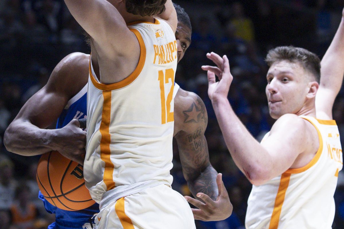 Tennessee Volunteers forward Cade Phillips fouls Kentucky Wildcats guard Otega Oweh during the NCAA men’s basketball tournament Sweet Sixteen game vs. the Tennessee Volunteers on Friday, March 28, 2025, at Lucas Oil Stadium in Indianapolis, Indiana. Tennessee won 78-65. Photo by Christian Kantosky | Assistant Photo Editor