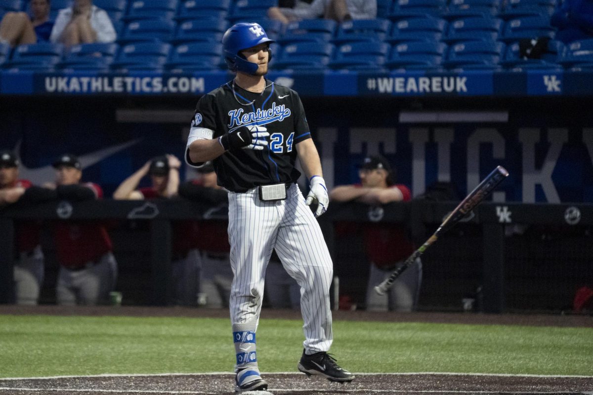 Kentucky infielder Dylan Koontz (24) throws his bat away after being walked during the baseball game vs. NIU on Tuesday, March. 11, 2025, at Kentucky Proud Park in Lexington, Kentucky.  Photo by Matthew Mueller | Photo Editor