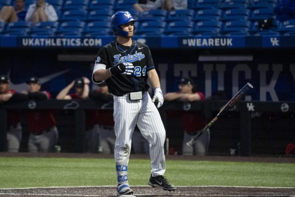 Kentucky infielder Dylan Koontz (24) throws his bat away after being walked during the baseball game vs. NIU on Tuesday, March. 11, 2025, at Kentucky Proud Park in Lexington, Kentucky.  Photo by Matthew Mueller | Photo Editor