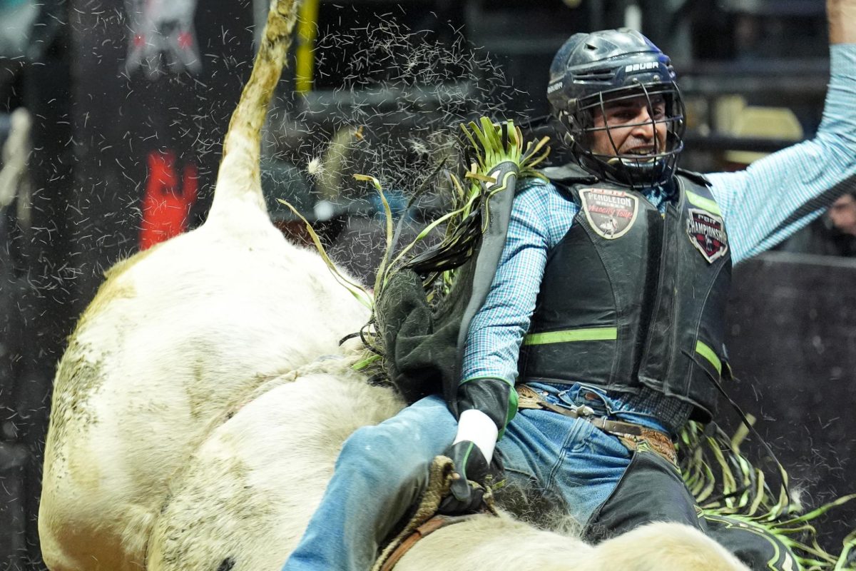 Eric Henrique Domingos struggles to stay on his bull during the Professional Bull Riders Event on Friday, March 7, 2025, at Rupp Arena in Lexington, Kentucky. Photo by Christian Kantosky | Assistant Photo Editor