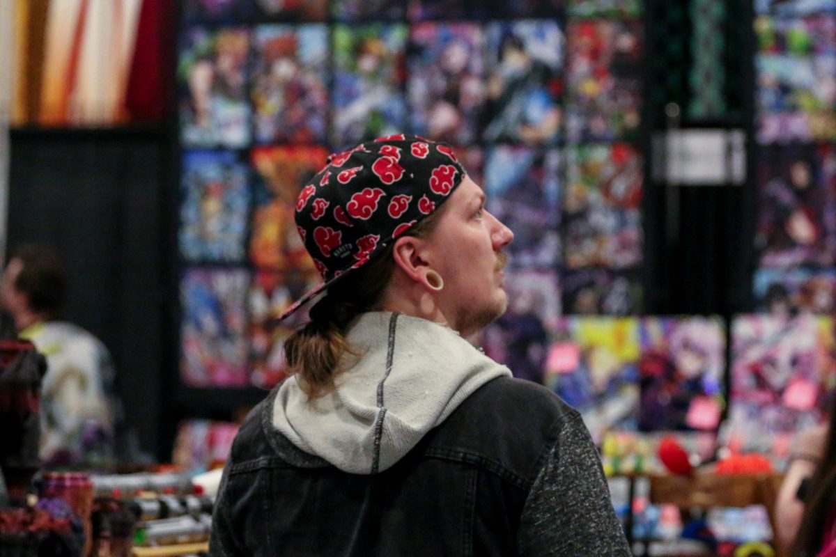 An attendee looks around at all the booths during the Lexington Comic and Toy Convention on Friday, March 7, 2025, at Central Bank Center in Lexington, Kentucky. Photo by Hannah Piedad | Staff