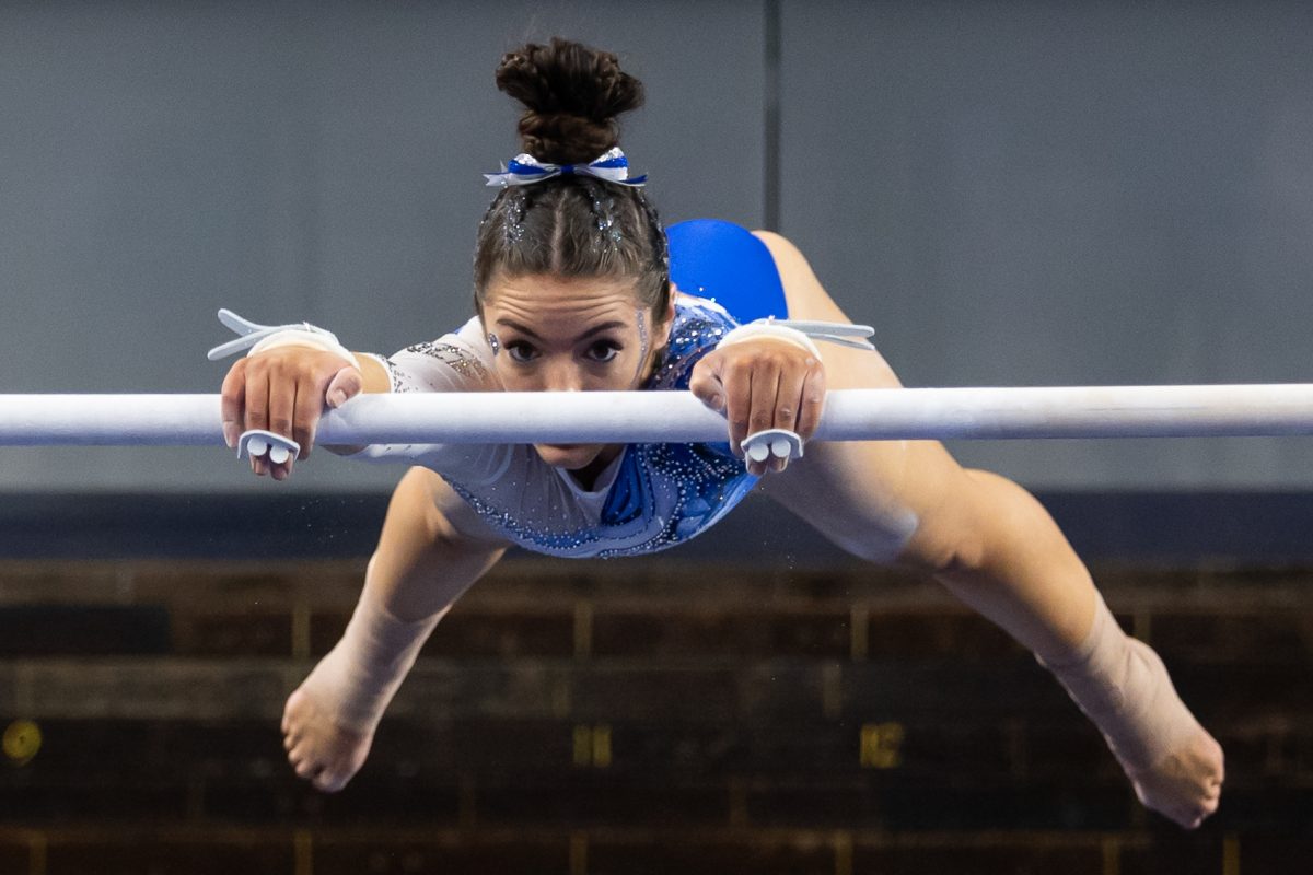 Kentucky Wildcat Gymnast, Isabella Rivelli, performs her bars routine during the Senior Night meet vs. Arkansas on Friday, Mar. 7, 2025, at Historic Memorial Coliseum in Lexington, Kentucky. Kentucky won 197.925-197.725. Photo by Jack Stamats | Staff