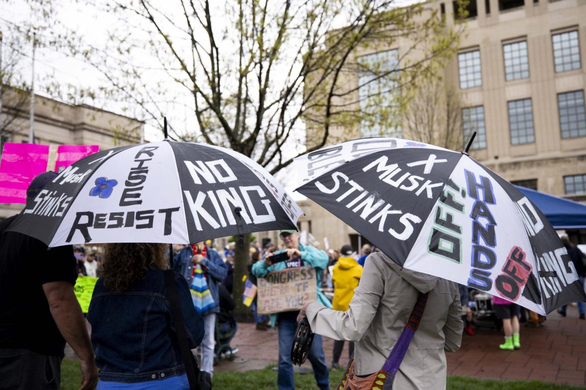 Protesters hold umbrellas with diffrent pro “Hands Off!” statements during the “Hands Off!” protest on Saturday, April. 5, 2025, at Robert F. Stephens Courthouse Plaza in Lexington, Ky Photo by Matthew Mueller | Photo Editor
