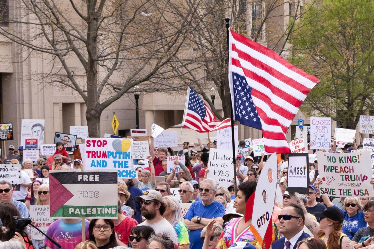 Over 2,000 protestors hold up signs and flags during the “No Kings: Then or Now!” protest on Saturday, April 19, 2025, at Robert F. Stephens Courthouse Plaza in Lexington, Ky. Photo by Cara Raiford | Staff