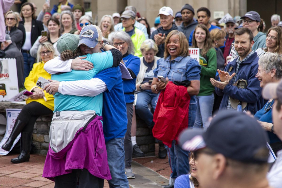 Two members of the American Federation of Teachers embrace during the “Hands Off!” protest on Saturday, April 5, 2025, at Robert F. Stephens Courthouse Plaza in Lexington, Ky. Photo by Christian Kantosky | Assistant Photo Editor