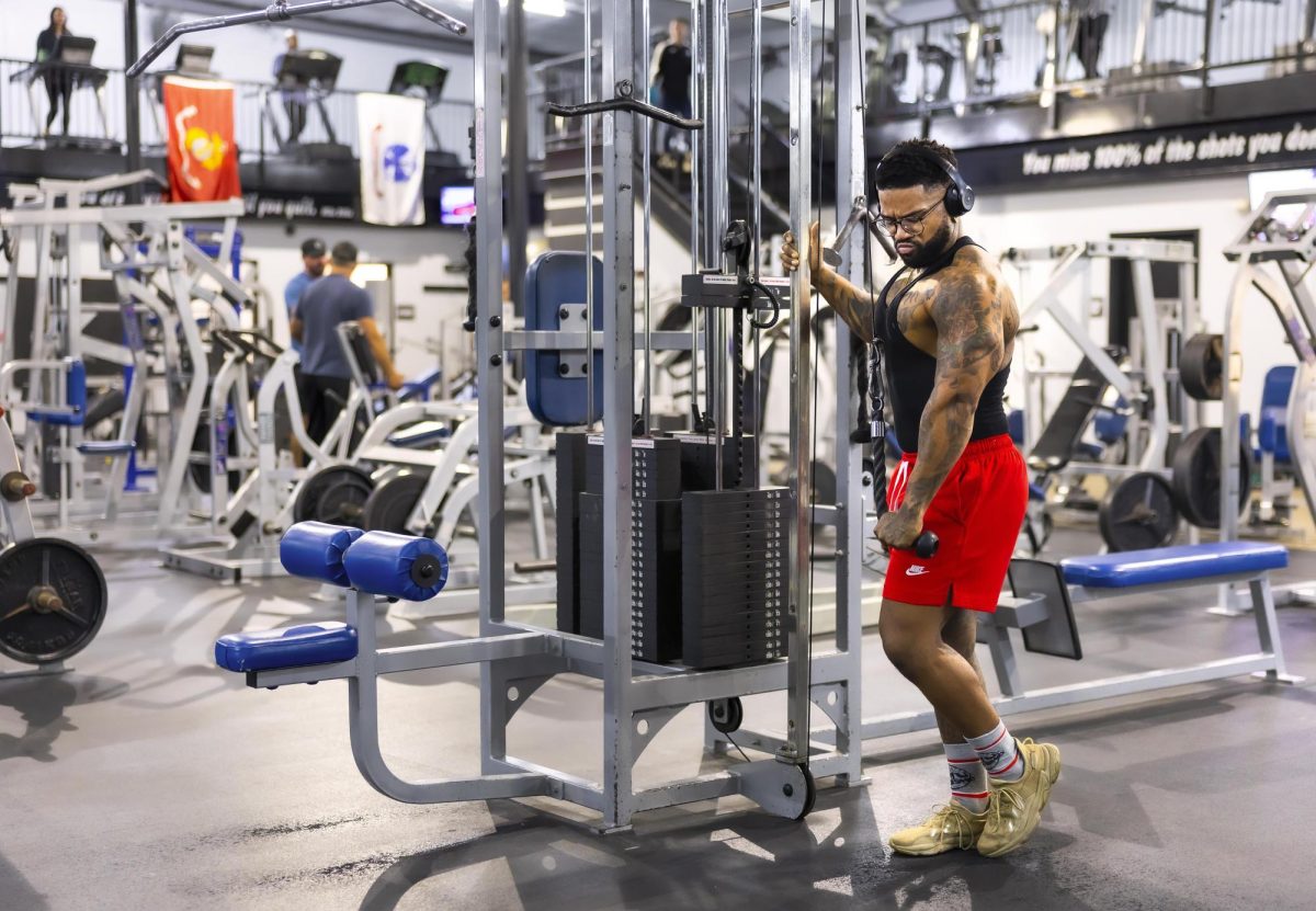 Dexter Banks takes a moment to reflect while doing cable pulls on Friday Oct. 25, 2024, at Image Fitness, in Harrodsburg, Kentucky. He is training to compete in an amateur body building competition next August after placing 4th in Kentucky at his first competition this year. Photo by Christian Kantosky | Assistant Photo Editor