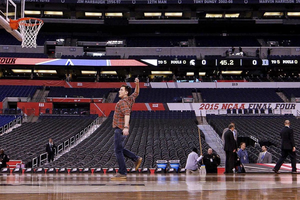 Jonathan Krueger pretends to dunk an imaginary ball before the NCAA Final Four game on April 4, 2015, in Indianapolis, Indiana. Photo provided by Chet White