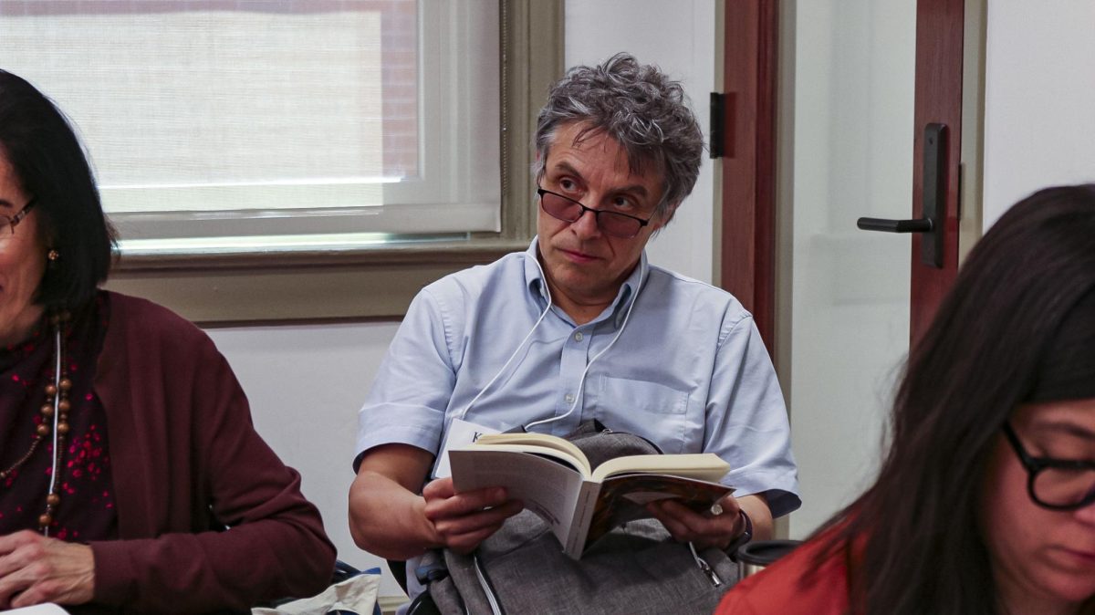 Attendees listen to poetry recited in both Spanish and English at the Kentucky Foreign Language Clinic Bilingual Poetry Reading on Friday, April 19, 2025, at Patterson Hall in Lexington, Kentucky. Photo by Chloe Bradley | Staff