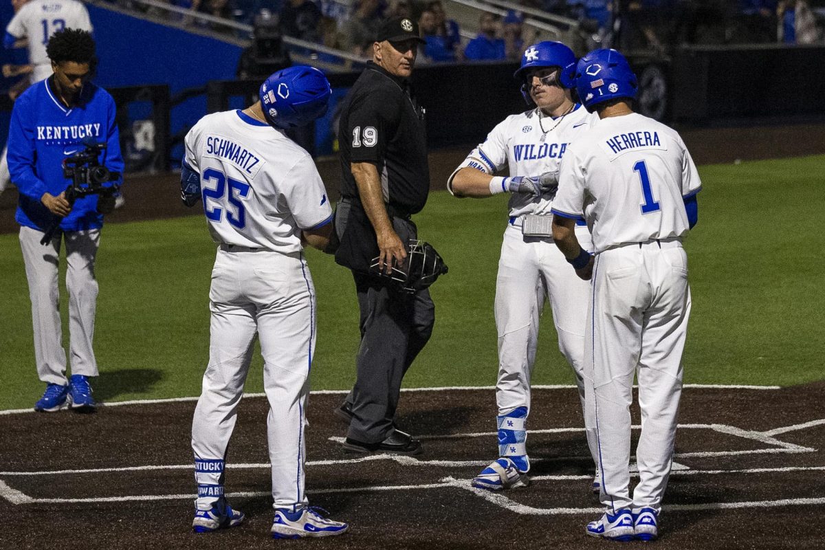 Kentucky outfielder Carson Hansen (34), Dylan Koontz (25) and Patrick Herrera (1) celebrate a home run during the Kentucky vs Louisville baseball game on Tuesday, Apr. 22, 2025 at Kentucky Proud Park in Lexington, Kentucky. Kentucky won 17-5. Photo by Sydney Yonker | Staff