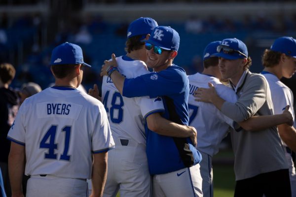 Kentucky pitcher Ben Cleaver (48) hugs a Kentucky coach before the Kentucky vs Louisville baseball game on Tuesday, Apr. 22, 2025 at Kentucky Proud Park in Lexington, Kentucky. Kentucky won 17-5. Photo by Sydney Yonker | Staff