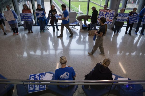 The Peaceful Bluegrass Resistance protests before the board of trustees meeting on Friday, April 25, 2025, at the Gatton Student Center in Lexington, Ky. Photo by Christian Kantosky | Assistant Photo Editor