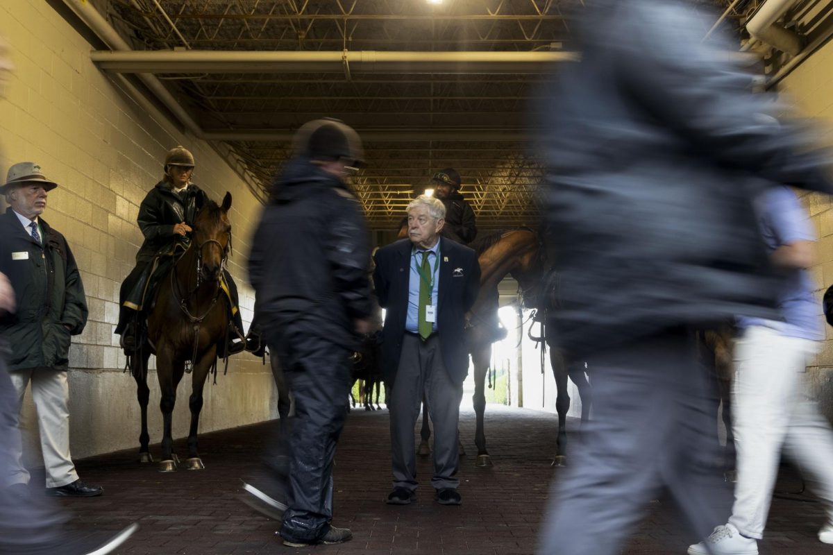 Keeneland workers gaurd the entrance to the track before races begin during Spring Closing Day on Friday, April 25, 2025, at Keeneland Racetrack in Lexington, Kentucky. Photo by Sydney Novack | Staff