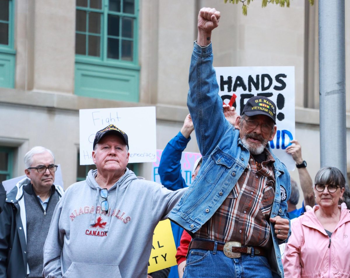 Veteran raises his fist in the air during the “Hands Off!” protest on Saturday, April 5, 2025, at Robert F. Stephens Courthouse Plaza in Lexington, Ky. Photo by Cara Raiford | Staff