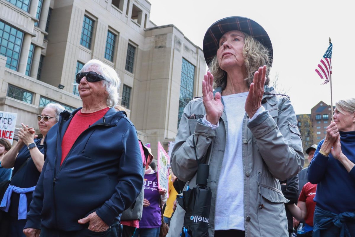 Protestors clap for the guest speaker during the “Hands Off!” protest on Saturday, April 5, 2025, at Robert F. Stephens Courthouse Plaza in Lexington, Ky. Photo by Cara Raiford | Staff