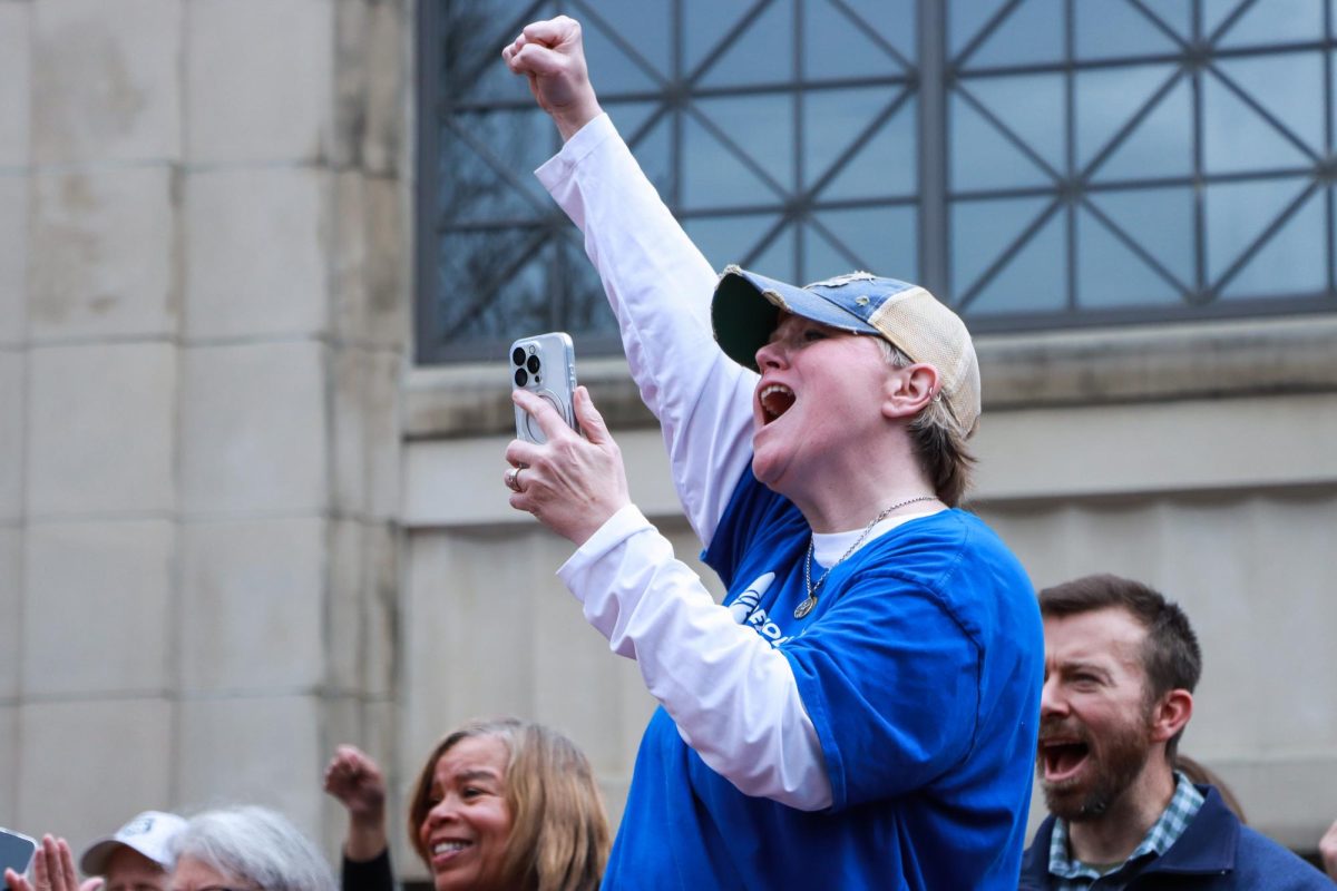 Protestors raise their fists in the air during the “Hands Off!” protest on Saturday, April 5, 2025, at Robert F. Stephens Courthouse Plaza in Lexington, Ky. Photo by Cara Raiford | Staff