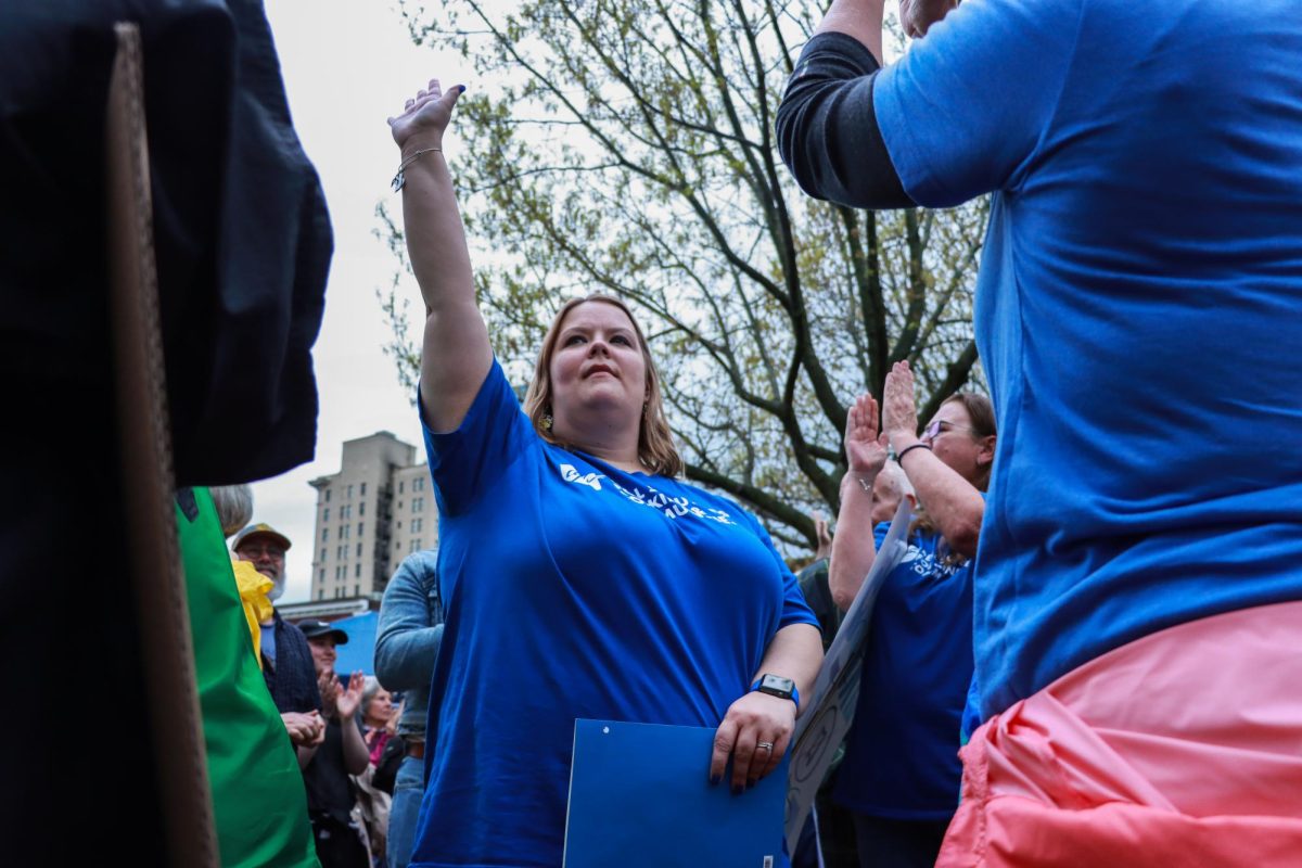 Teachers raise their handds to be recognized during the “Hands Off!” protest on Saturday, April 5, 2025, at Robert F. Stephens Courthouse Plaza in Lexington, Ky. Photo by Cara Raiford | Staff