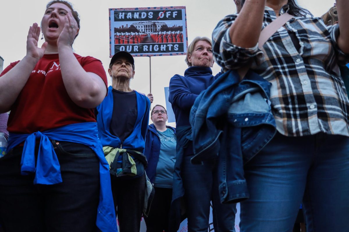 Protesters stand and listen to speaker during the “Hands Off!” protest on Saturday, April 5, 2025, at Robert F. Stephens Courthouse Plaza in Lexington, Ky. Photo by Cara Raiford | Staff