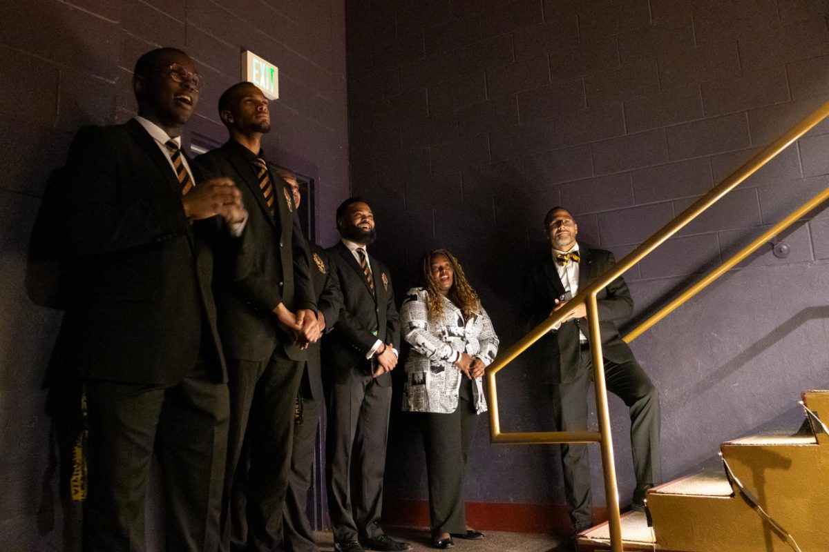 UK students, faculty, and speakers stand off stage listening to “Lift Every Voice and Sing” during the Senior Salute hosted by Alpha Phi Alpha on Wednesday, May 7, 2025, at Lyric Theatre & Cultural Arts Center  in Lexington, Kentucky. Photo by Sydney Novack | Staff
