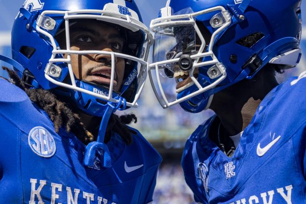 Kentucky Wildcats wide receiver Hardley Gilmore IV, right, celebrates with running back Dante Dowdell, left, after he scores a touchdown during the football game vs. Toledo on Saturday, Aug. 30, 2025, at Kroger Field in Lexington, Ky. Kentucky won 24-16. Photo by Christian Kantosky | Photo Editor