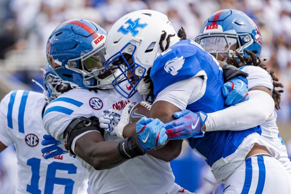 Kentucky Wildcats running back Dante Dowdell (2) is tackled by Ole Miss players during the football game against Ole Miss on Saturday, Sept. 6, 2025, at Kroger Field in Lexington, Ky. Photo by Christian Kantosky | Photo Editor