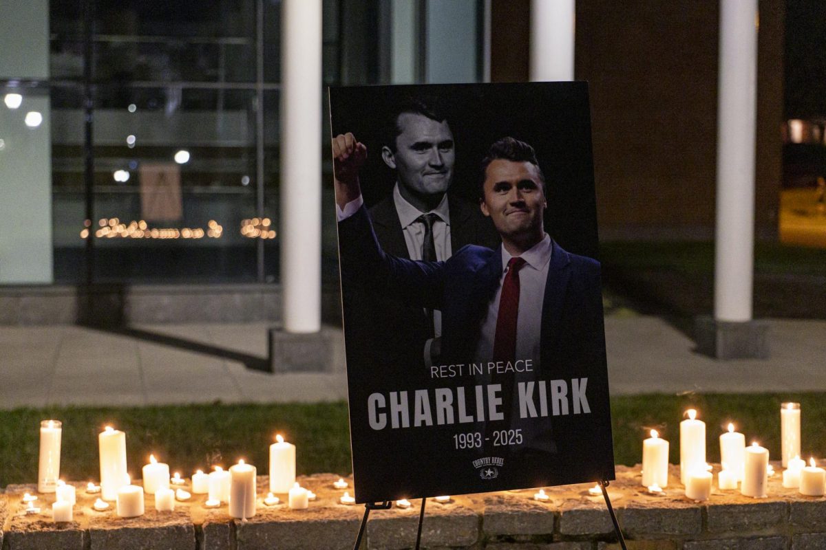 A sign for Charlie Kirk is seen during the candlelight vigil in memory of Charlie Kirk on Sunday, Sept. 14, 2025, outside Memorial Hall in Lexington, Ky. Photo by Christian Kantosky | Photo Editor