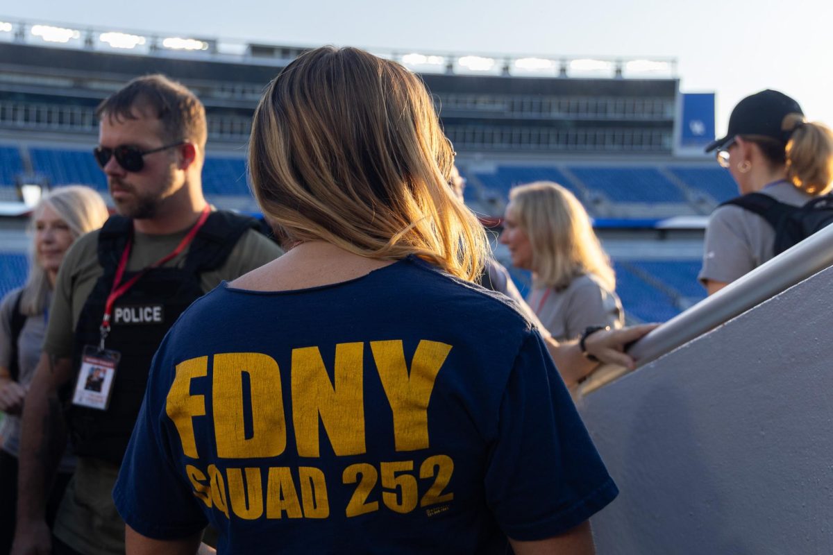 Kristen Kuveikis stands amongst 9/11 Memorial Stair Climb participants on Thursday, Sept. 11, 2025, at Kroger Field in Lexington, Ky. Photo by Isabella Sepahban | Staff