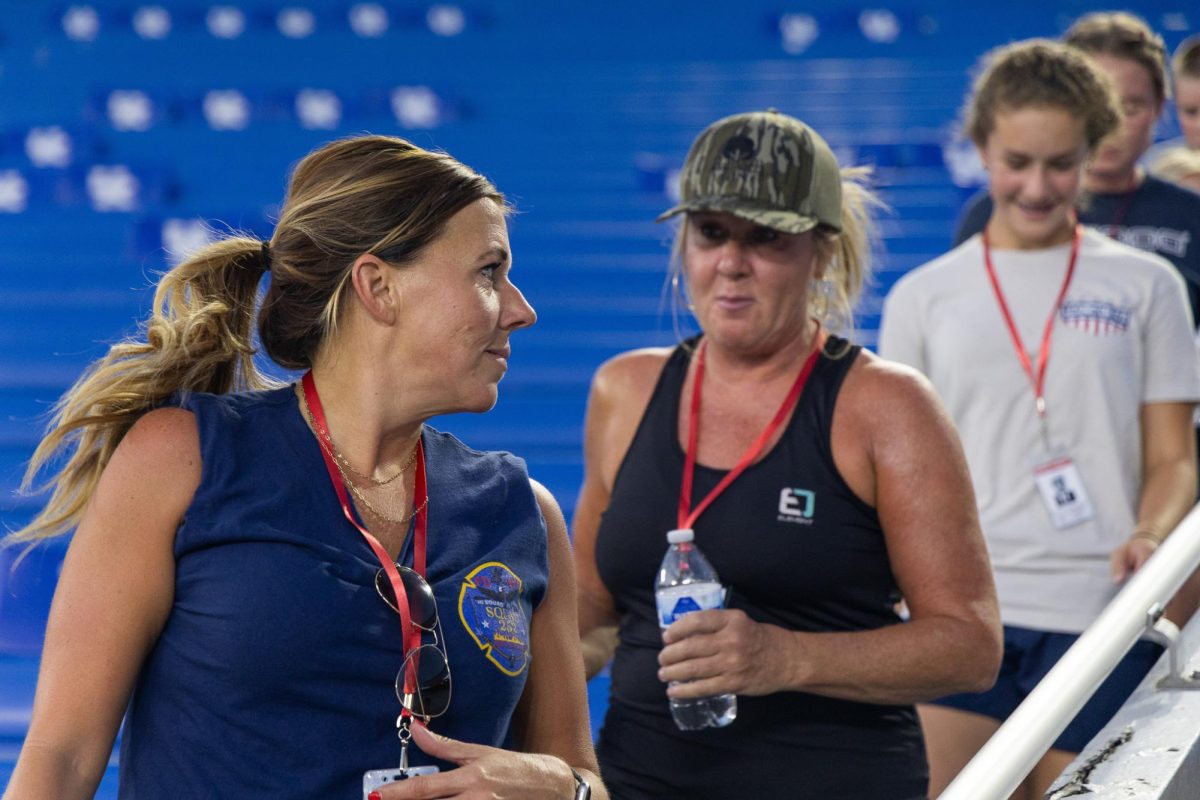 Kristen Kuveikis, left, talks to her friend Kristie Mack, right, while walking down the stairs of the lower bowl during the 9/11 Memorial Stair Climb on Thursday, Sept. 11, 2025, at Kroger Field in Lexington, Ky. Photo by Isabella Sepahban | Staff
