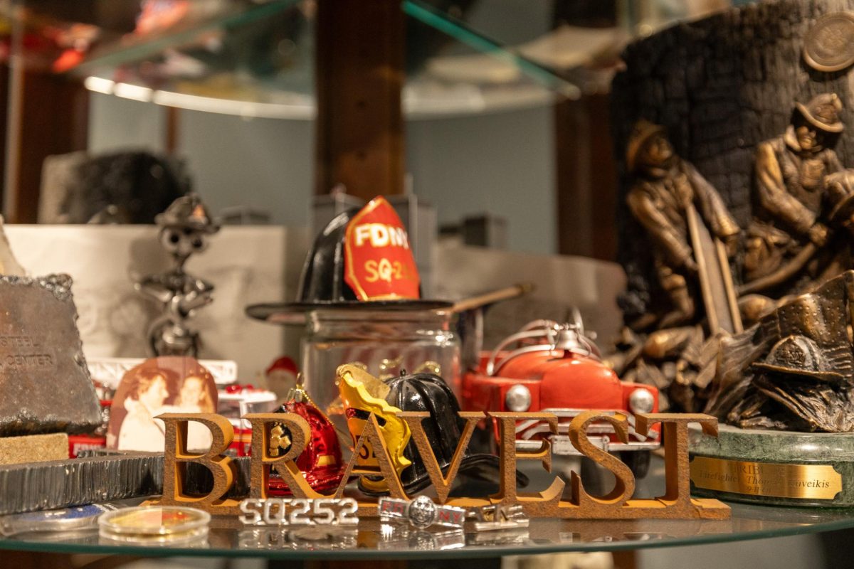 A variety of items commemorating Thomas Kuveikis’ legacy as a firefighter are seen on display on Tuesday, Sept. 9, 2025, at Kristen Kuveikis’ house in Wilmore, Ky. Photo by Isabella Sepahban | Staff
